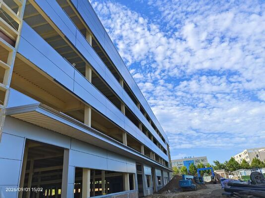 16,800㎡ steel structure building with partial four floors, adopting polyurethane sandwich wall panels for superior insulation performance.